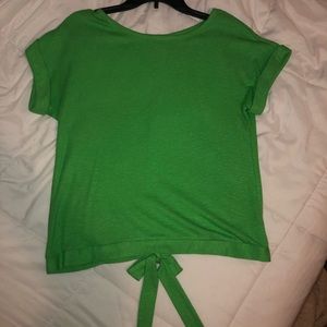 Green open back blouse.